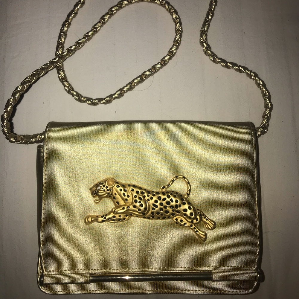 Gold clutch with diamond eye cheetah